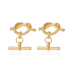 Elegante goldene Knoten T-Steg Ohrringe mit schickem geometrischem Design für moderne Damenmode.