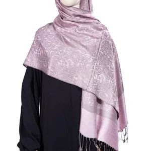 Elegant pink paisley jacquard pashmina hijab scarf with tassels shown on black dress