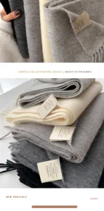 Detail view of 100% premium Australian wool scarves with fringed edges and labels