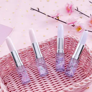 Close-up detail of cute lipstick-shaped gel pens with sparkling glitter in a pink basket.