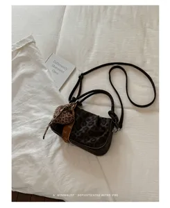 Retro leopard print ruched shoulder bag, trendy cloud handbag with crossbody strap and chic charm.