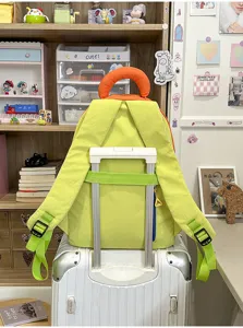 Color-block Korean casual backpack for women and students, lightweight travel school bag.