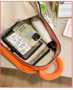 Korean color-blocking casual backpack for women and students, lightweight travel school bag.