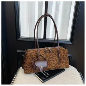 Brown leopard print shoulder bag with dual handles and mini pouch, trendy women's handbag detail.
