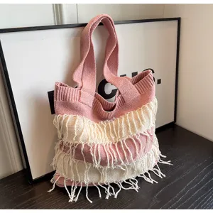 Stylish pink and white knit tote bag with fringe design, casual shoulder bag for women.