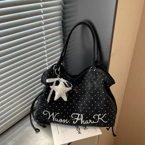 Korean style black polka dot tote bag with star pendant and embroidery details for daily commuting.