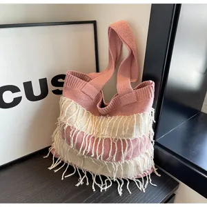 Stylish pink cream knitted fringe shoulder bag, spacious casual tote for daily use and beach.