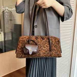 Leopard print shoulder bag with stylish strap and mini pouch detail, casual chic daily handbag.