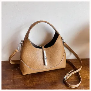 Brown leather hobo shoulder bag with stylish metal lock closure and adjustable strap.