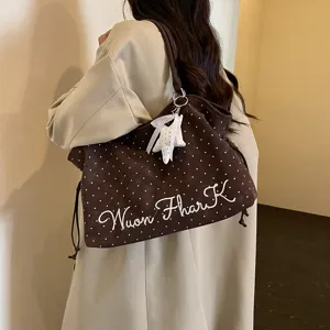 Korean style polka dot tote bag detail, featuring white star pendant and embroidered text.