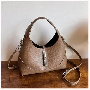 Stylish brown leather hobo shoulder bag with metal lock design for women everyday use.
