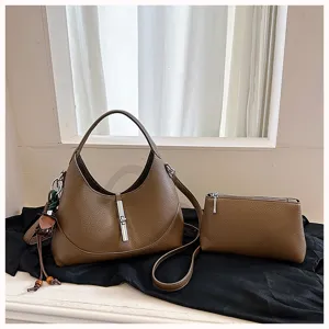Brown leather hobo shoulder bag with metal lock closure and matching pouch for women.