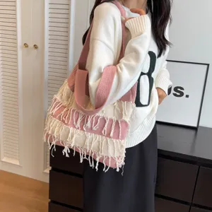 Stylish knitted shoulder bag with fringe, pink and white casual tote for women everyday use.