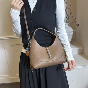 Chic brown leather hobo shoulder bag with metal lock, versatile everyday stylish purse.