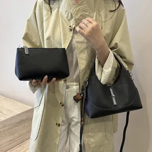 Stylish black hobo dumpling bag and clutch set, elegant shoulder handbag for women daily wear.