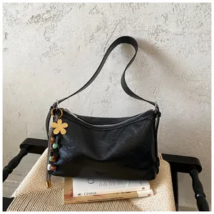 Black leather hobo shoulder bag for women, large casual crossbody purse with flower charm.