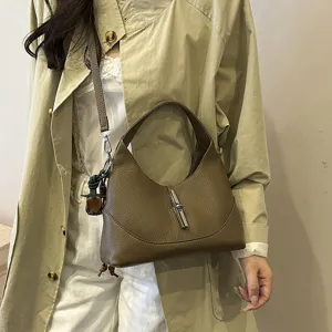 Stylish brown leather hobo shoulder bag for women, versatile crossbody purse with chic metal lock.