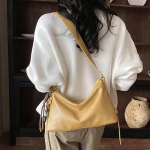 Stylish casual yellow shoulder crossbody bag for women, large capacity autumn commuter bag.