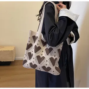 Stylish brown heart knitted shoulder bag, large capacity casual tote for autumn commute.