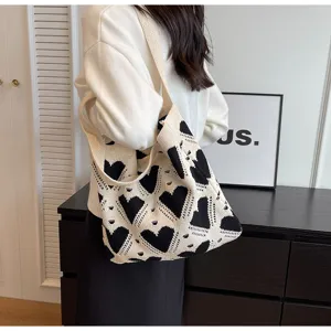 Black and white knit tote bag, casual heart pattern shoulder bag for women daily use.