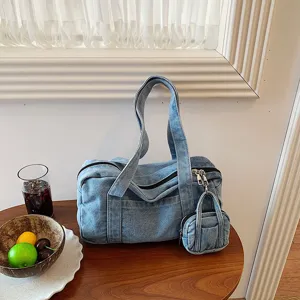 Detailed view of the retro denim handbag with mini coin purse, casual vintage shoulder bag.