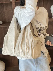 Amplio bolso tote de hombro casual de lona a rayas para la mujer y su uso diario.