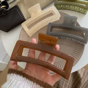 Trendy acrylic rectangular hair claw clip, large hollow shark clip for women and girls daily styling.