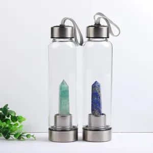 Eco-friendly glass water bottles with natural green and blue crystal pillars inside
