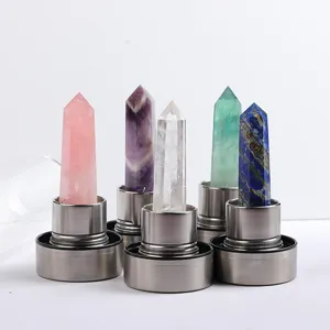 Collection of natural crystal elixir water bottle energy pillars on stainless steel bases