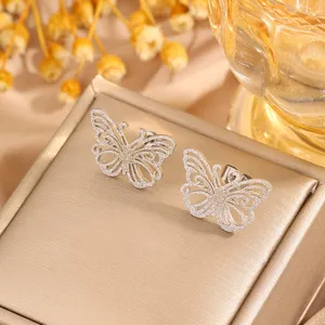 Detailed view of stainless steel butterfly stud earrings featuring delicate filigree openwork.
