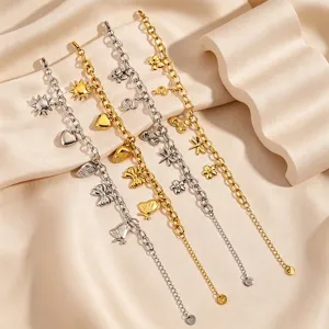 Close-up detail of multi-element charm bracelets featuring cute bow, shell, and heart pendants.