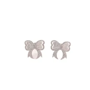 Stainless steel glitter bow stud earrings for women, elegant daily jewelry accessory.