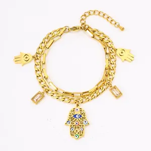 Stainless steel gold double layer bracelet detail with hamsa hand evil eye charms zircon.