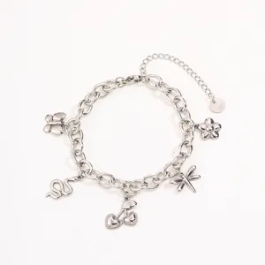 Stainless steel multi-charm bracelet detail featuring cute butterfly and cherry pendants.