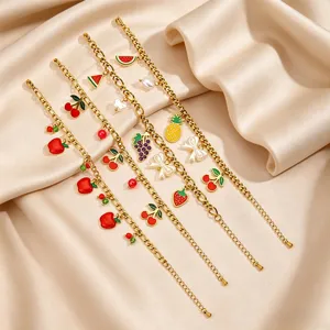 Exquisite stainless steel gold-plated bracelet featuring charming enamel fruit pendants for women.