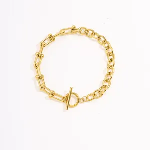 Gold stainless steel link bracelet with OT clasp, stylish minimalist wrist chain jewelry.