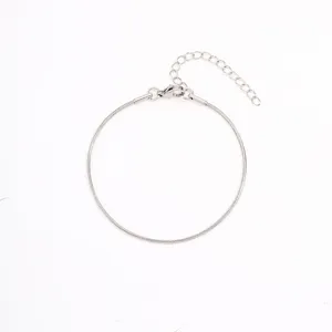 Close-up detail of the minimalist stainless steel round snake chain bracelet with extension.