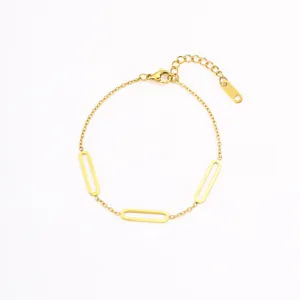 Detail view of minimalist gold stainless steel geometric link bracelet with extension chain.