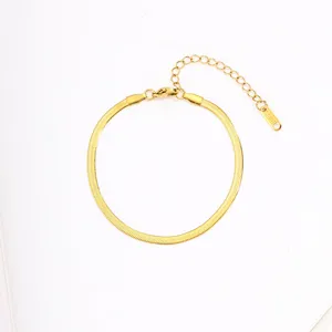 Gold stainless steel herringbone chain bracelet with adjustable extension for women.
