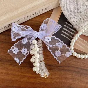 Korean style sweet lace bow pearl telephone cord hair tie detail shot for cute hairstyles.