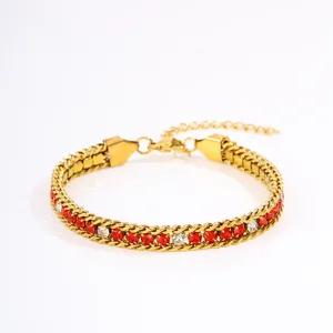 Close-up details of the luxury gold-tone titanium steel bracelet with red and white zirconia stones.