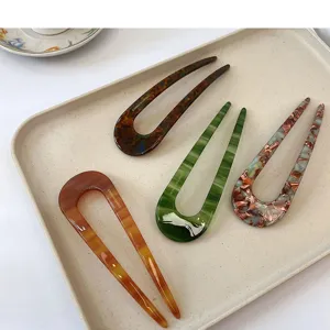 Forcine per capelli a U minimaliste, forcine tartaruga vintage per acconciature eleganti.