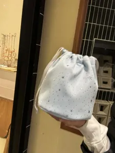Light blue starry drawstring pouch detail view, cute small storage bag for daily essentials.