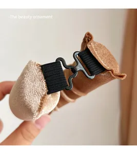 Detail view of heatless velvet hair curling rod clasp mechanism and sponge core texture.