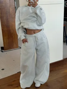 Oversized fleece hoodie and wide leg sweatpants two piece set detail view showing relaxed fit.