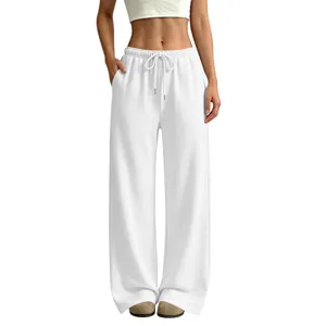 White high-waisted loose wide-leg fleece sweatpants casual trousers detail view showing fit.