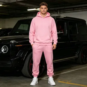 Men pink fleece hooded sweatshirt and jogger set scene detail shot, casual wear lifestyle.