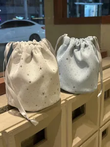 Cute star pattern drawstring pouch, portable makeup and accessory storage bag detail.