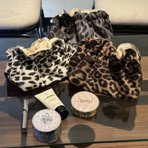 Leopard print cosmetic bag cloud pouch detail view, portable large capacity toiletry storage.