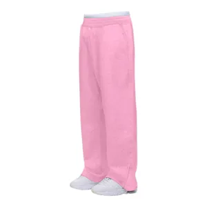 Pantalon de survêtement rose ample style Y2K avec taille élastique et ourlet zippé.